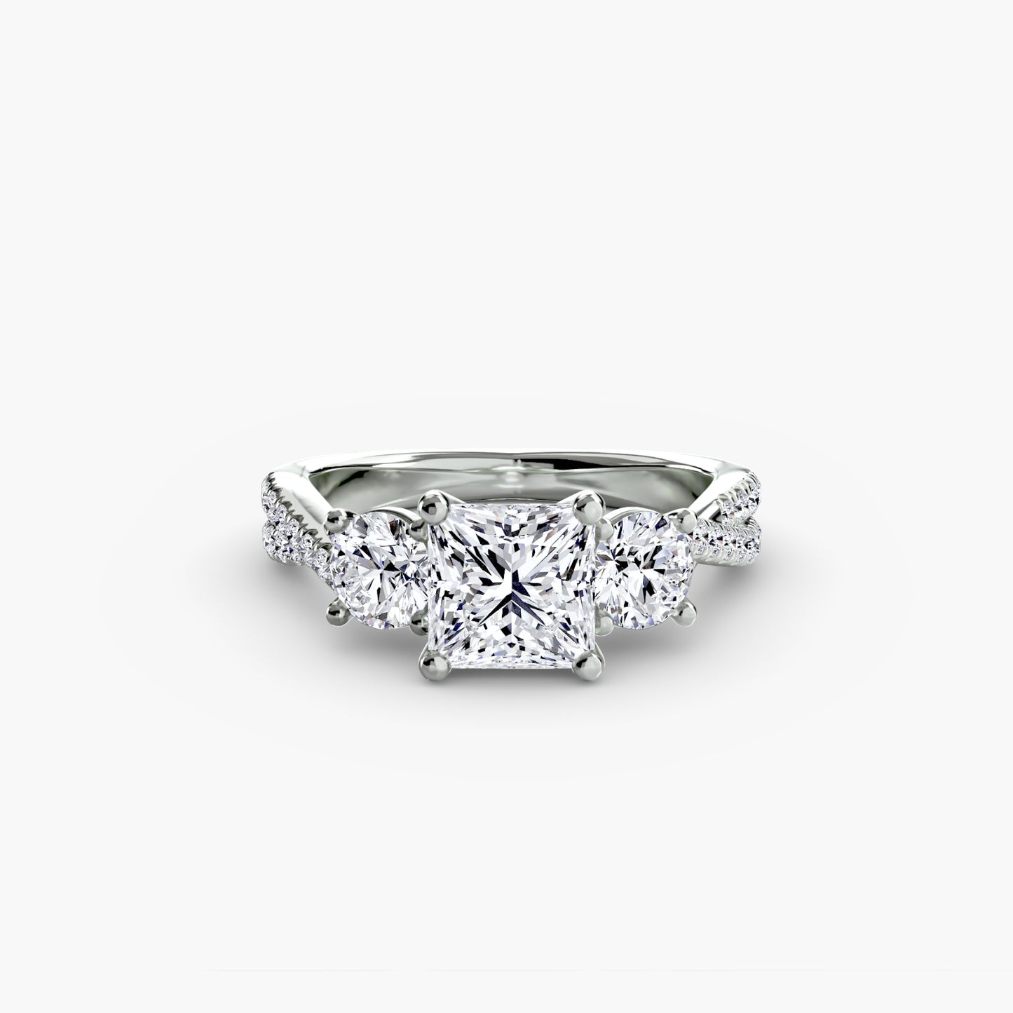 The Romantic Three-Stone Diamond ring with Pavé Band