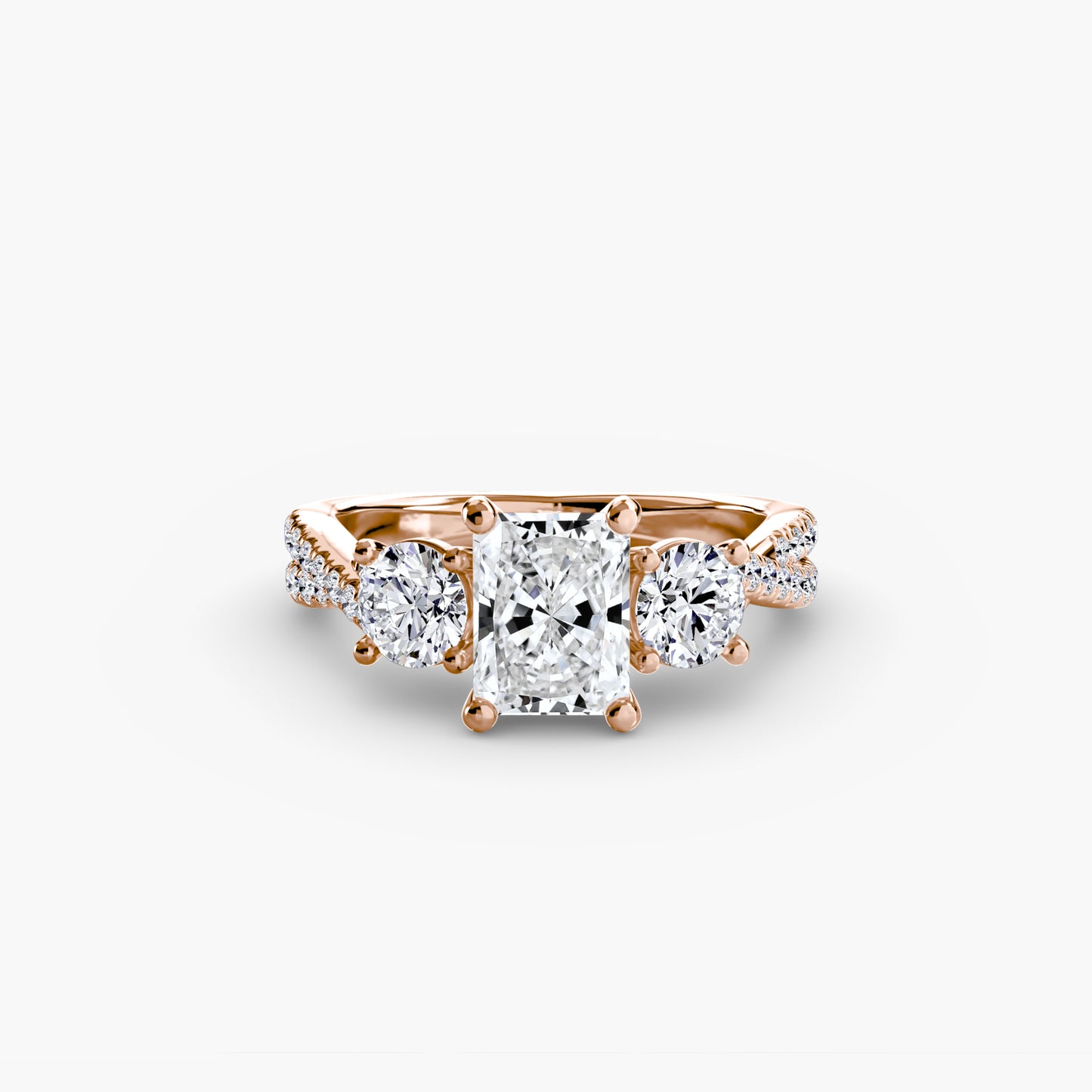 The Romantic Three-Stone Diamond ring with Pavé Band