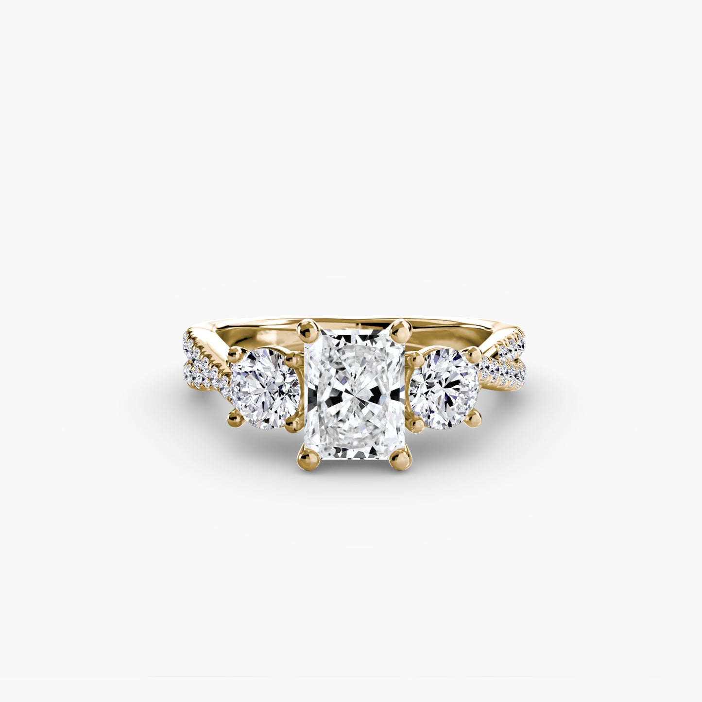 The Romantic Three-Stone Diamond ring with Pavé Band