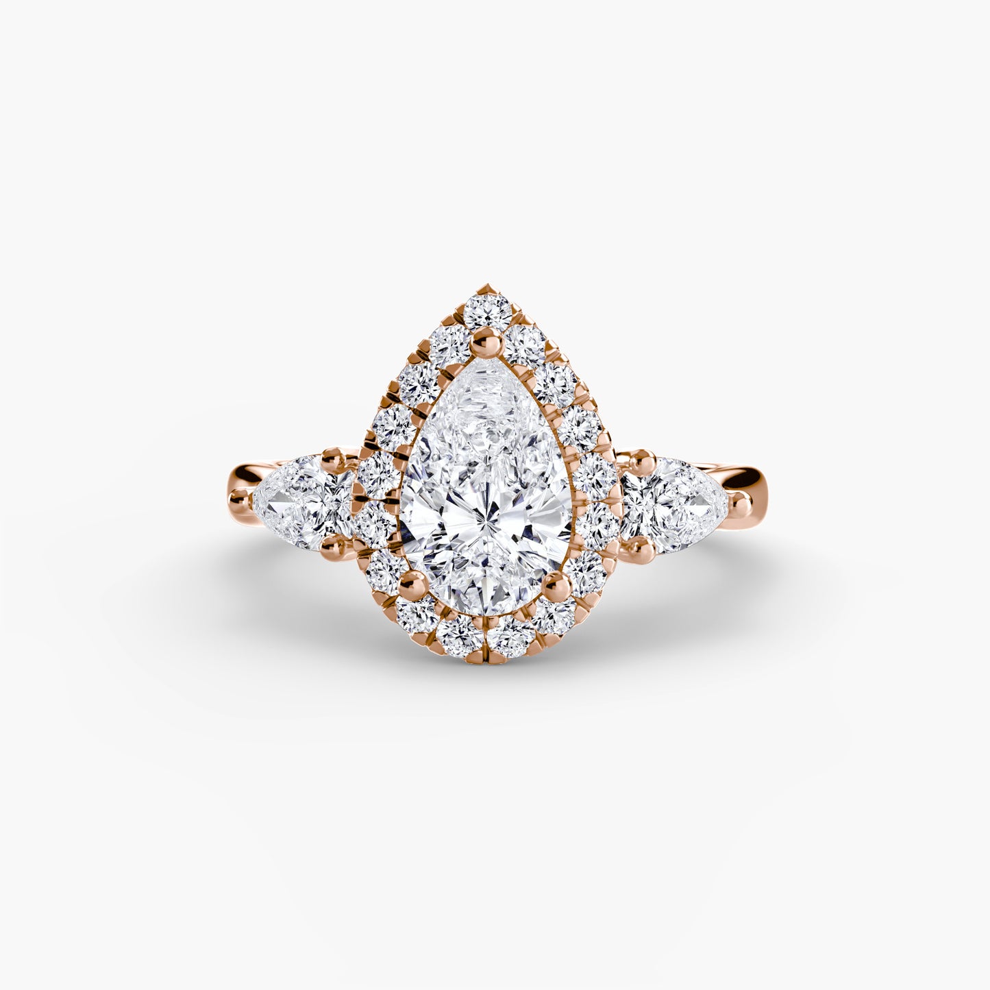 Elysian Three-Stone Ring pear shape diamond with Halo