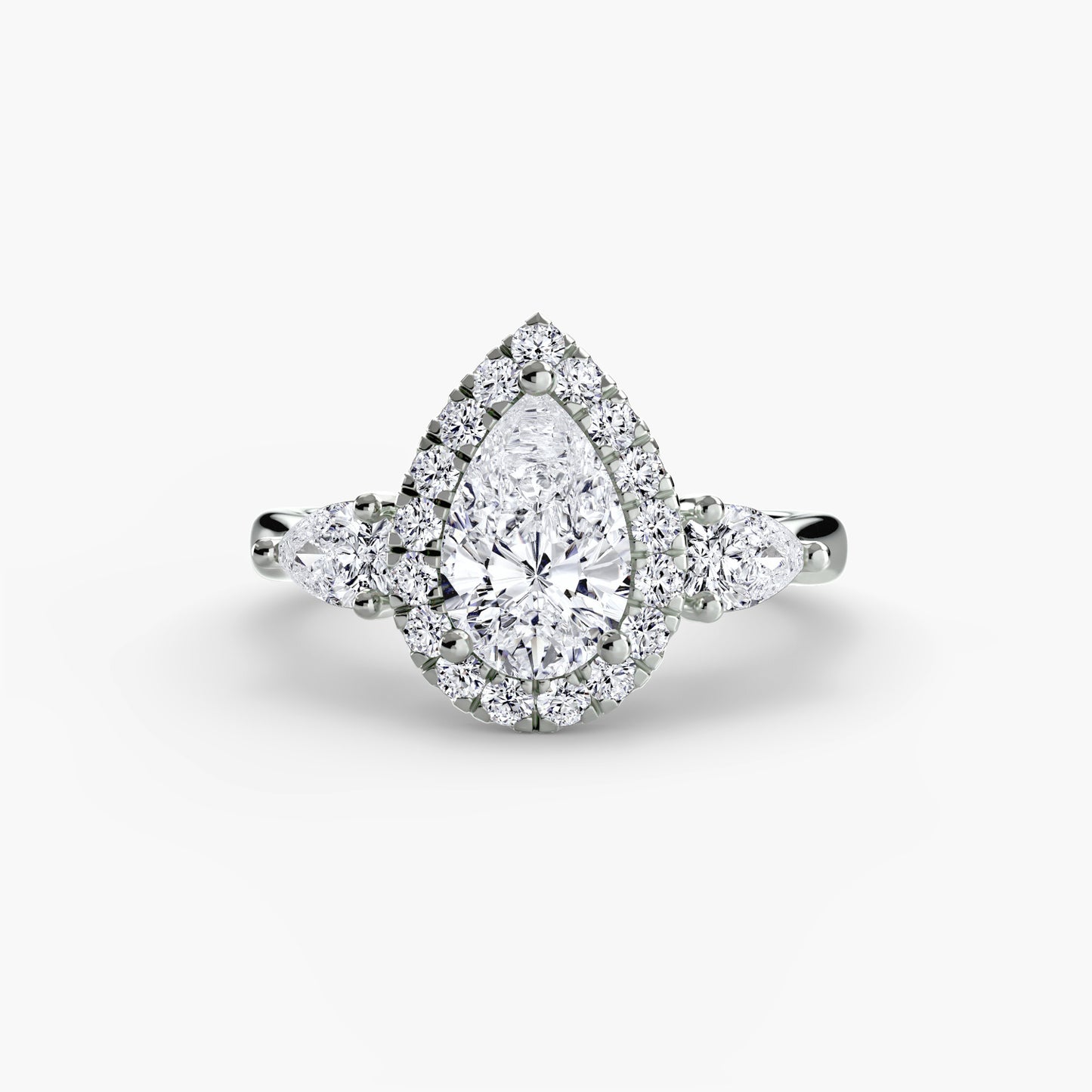 Elysian Three-Stone Ring pear shape diamond with Halo