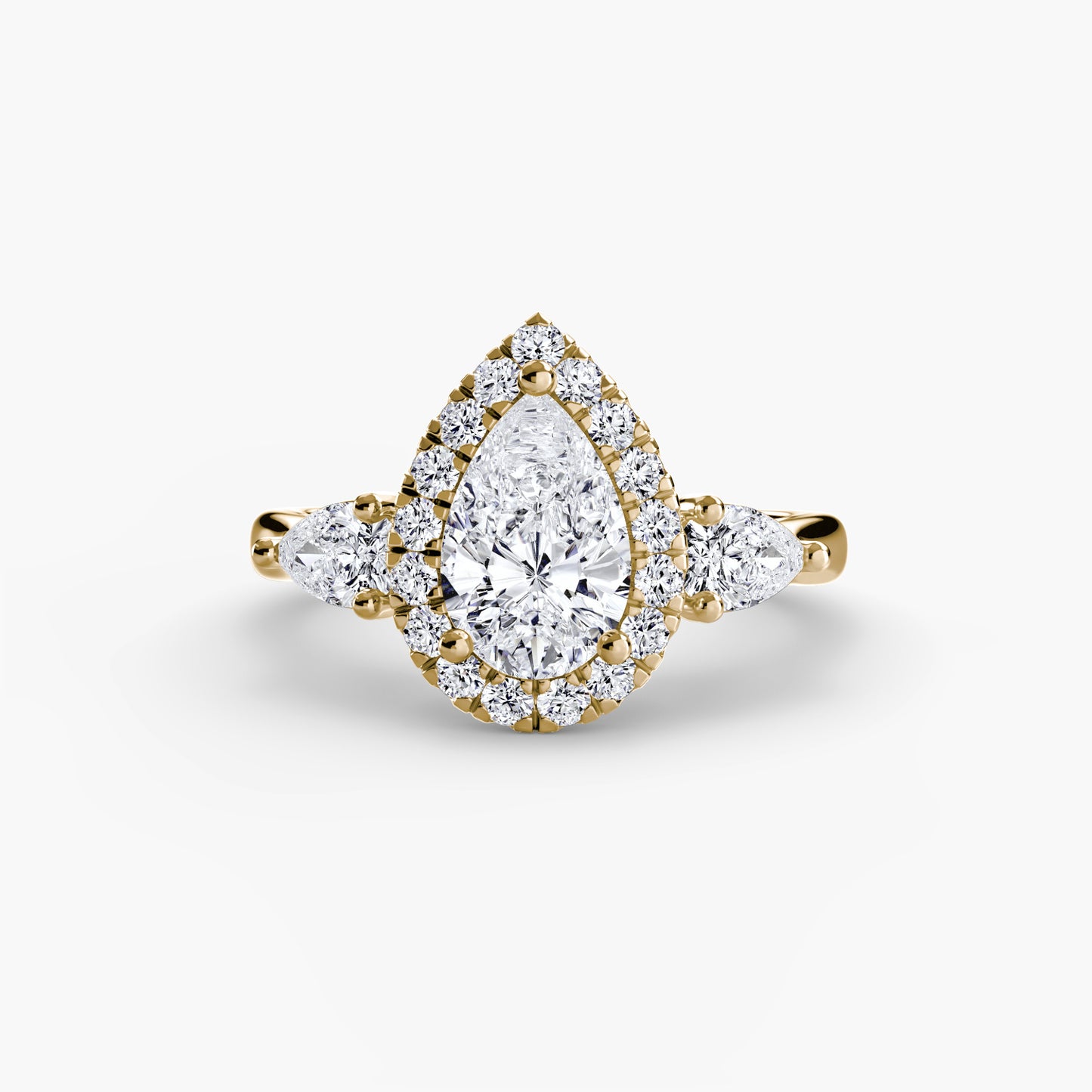 Elysian Three-Stone Ring pear shape diamond with Halo