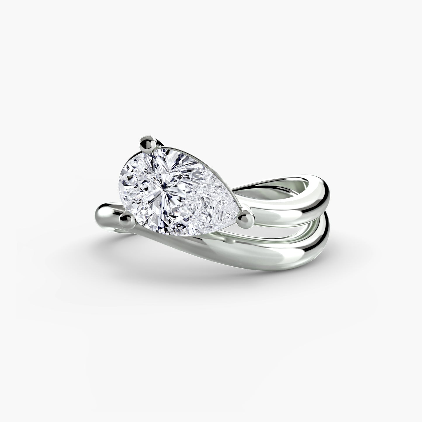 The Wave Ring with pear shape diamond double assymetrical band