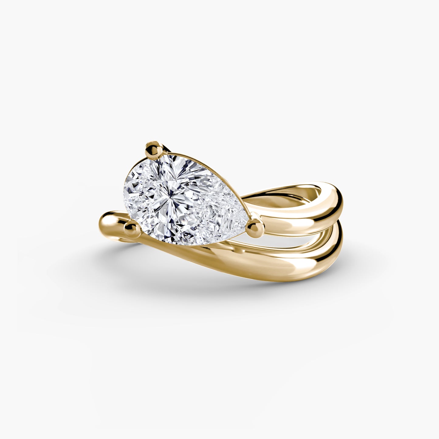 The Wave Ring with pear shape diamond double assymetrical band