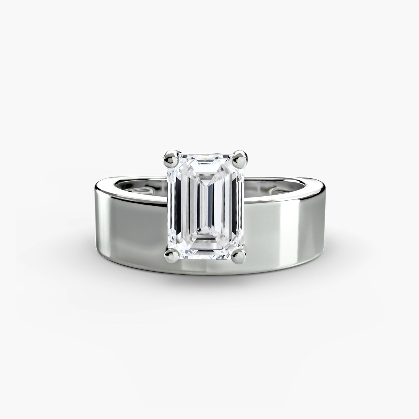Wide Band Solitaire with emerald cut diamond